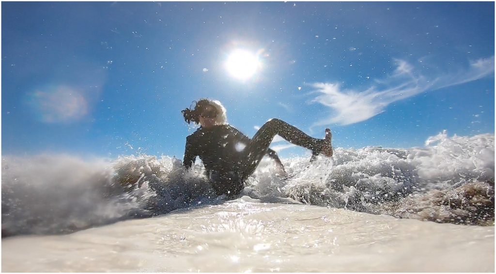 Surfer girl in Los Angeles and County Line in O'Neil and Billabong west suit. Shot on a GoPro.