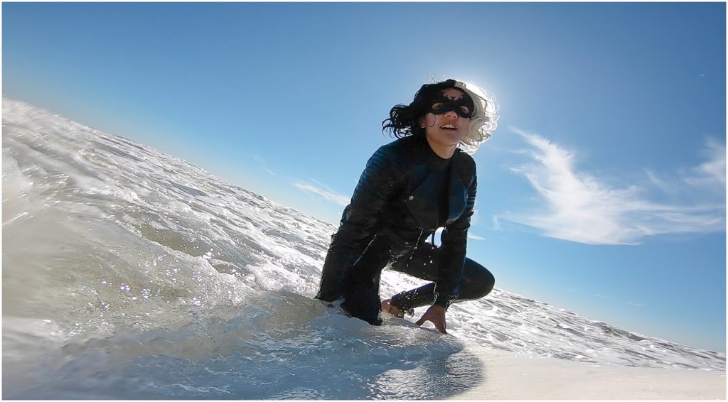 Surfer girl in Los Angeles and County Line in O'Neil and Billabong west suit. Shot on a GoPro.